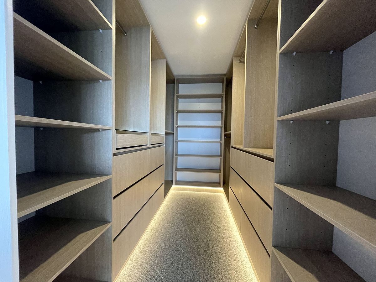 Custom walk-in robe with backlit shelving made by TIJ Australia